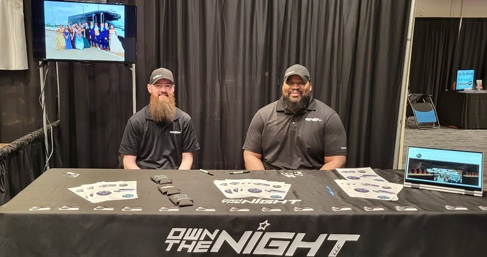 Adam and Kevin at the Own The Night booth.