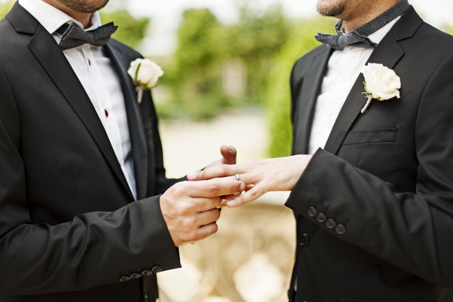 A couple dressed for a wedding.